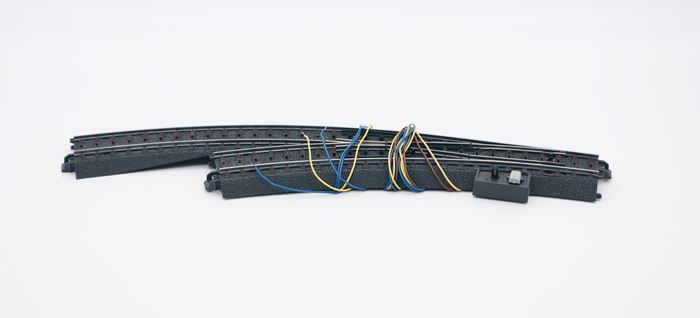 Märklin 24671 buesporskifte, venstre, elektrisk med lys